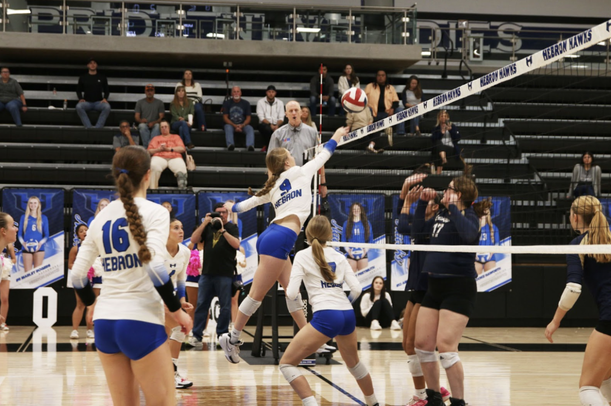 Middle blocker Lindy Lawley sets the ball during the third set of the Lady Hawks’ game against Little Elm on Oct. 19.. Despite losing this point, Hebron maintained its lead with the score being 8-5. 